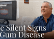 patient smiling looking at dental scans
